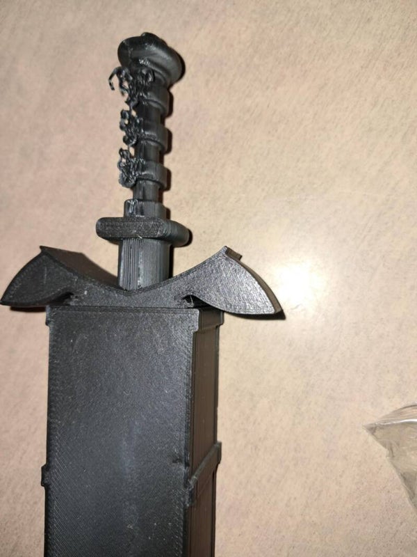 Slightly damaged black dice sword with green d&d dice