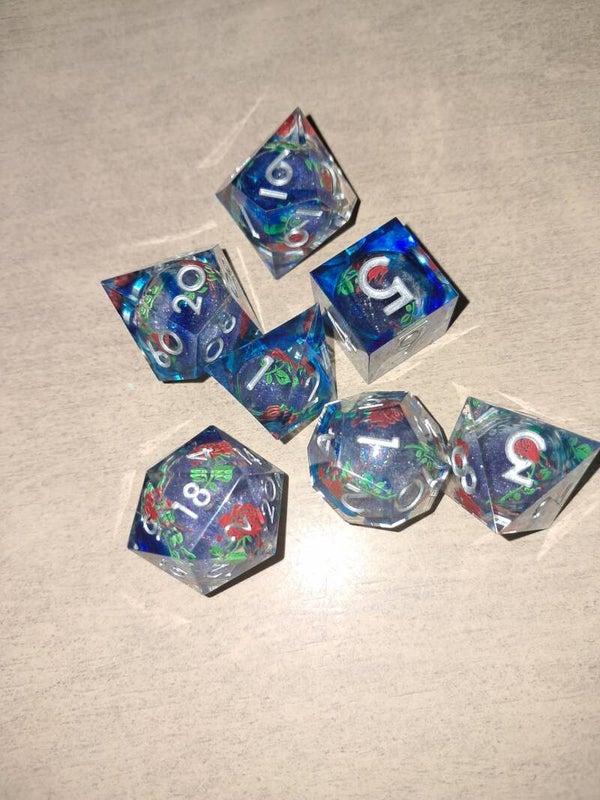 Liquid core Red Rose d&d dice (blue casing)