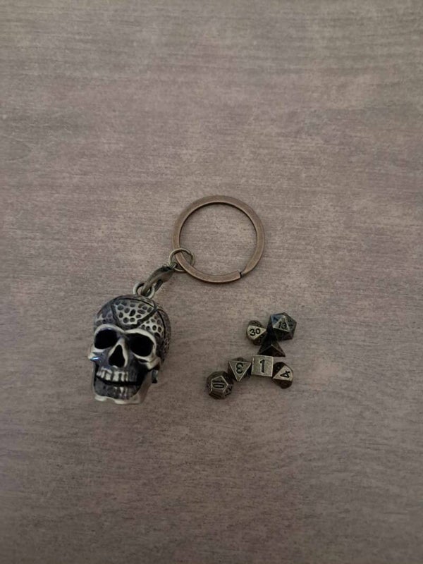 Skull dice cage with metal mini d&d dice