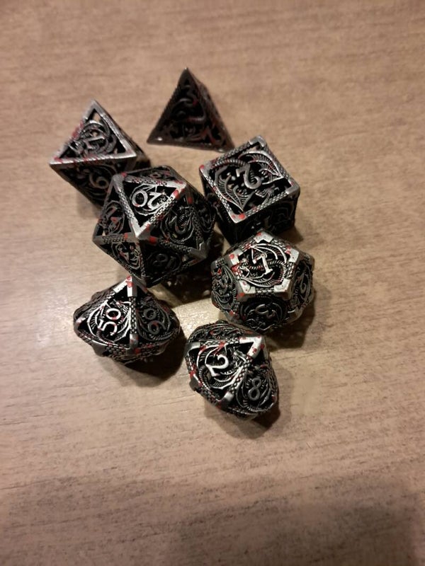 Metal bloodspattered dragon d&d dice
