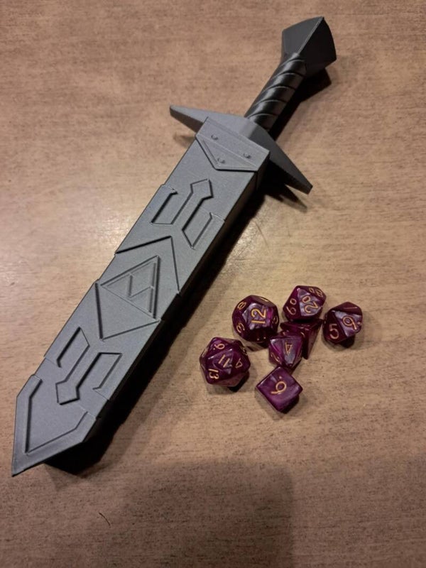 Grey dice sword with pink d&d dice