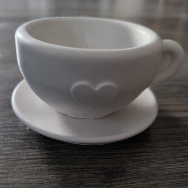 Gegoten koffiemok met schoteltje