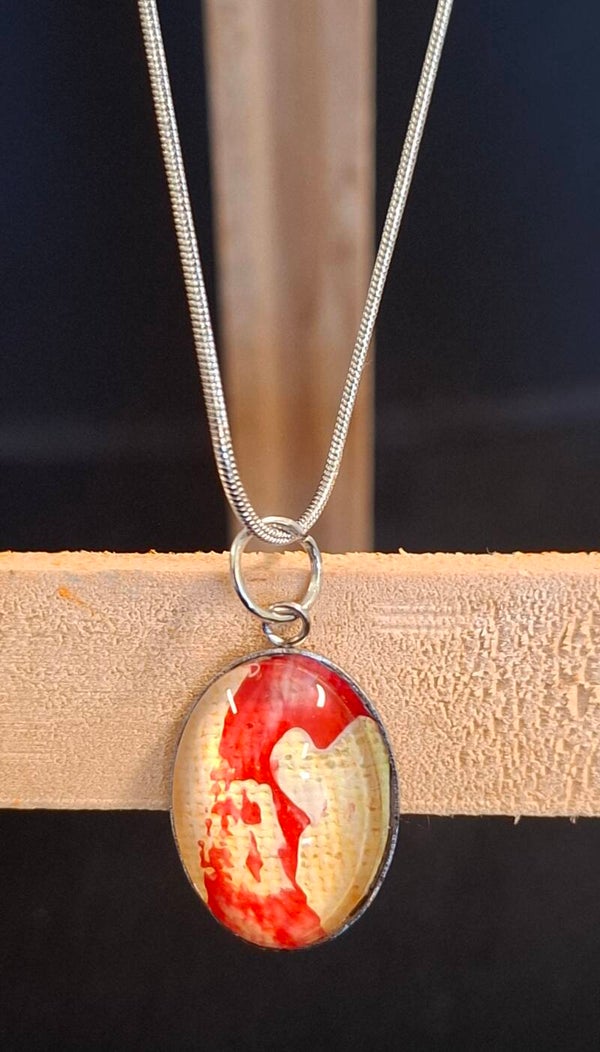 Ketting zilver ovaaltje rood/geel