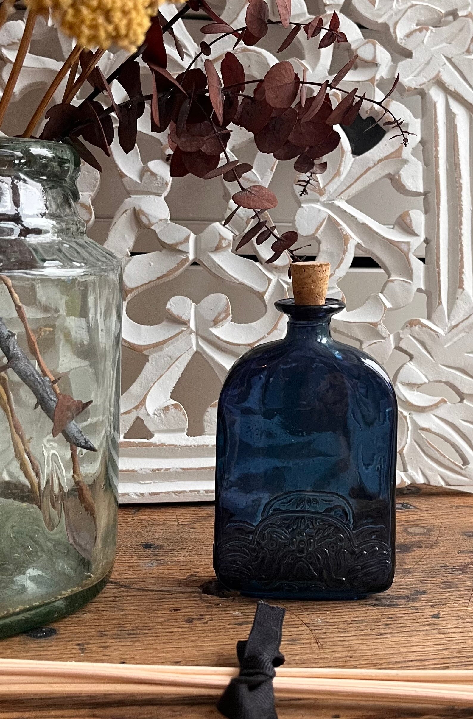 Blue embossed bottle with cork