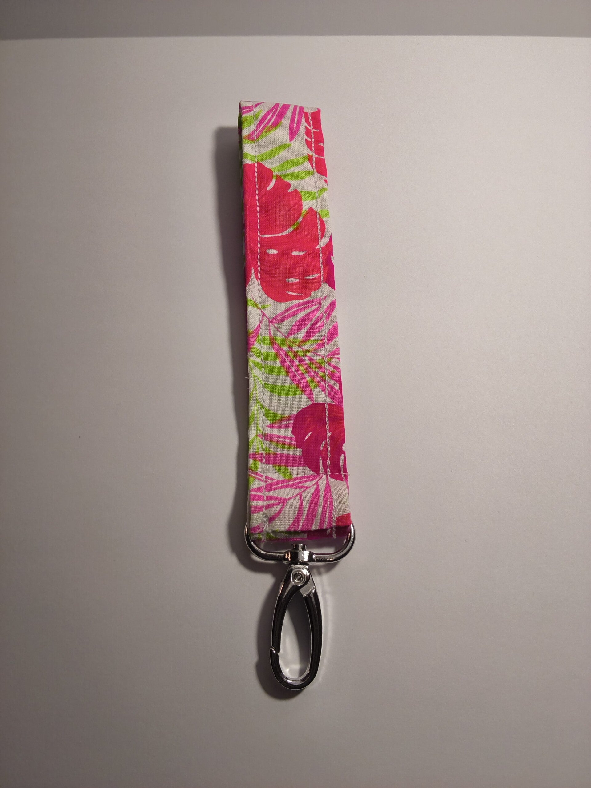 Pink and green tropical floral design keychain