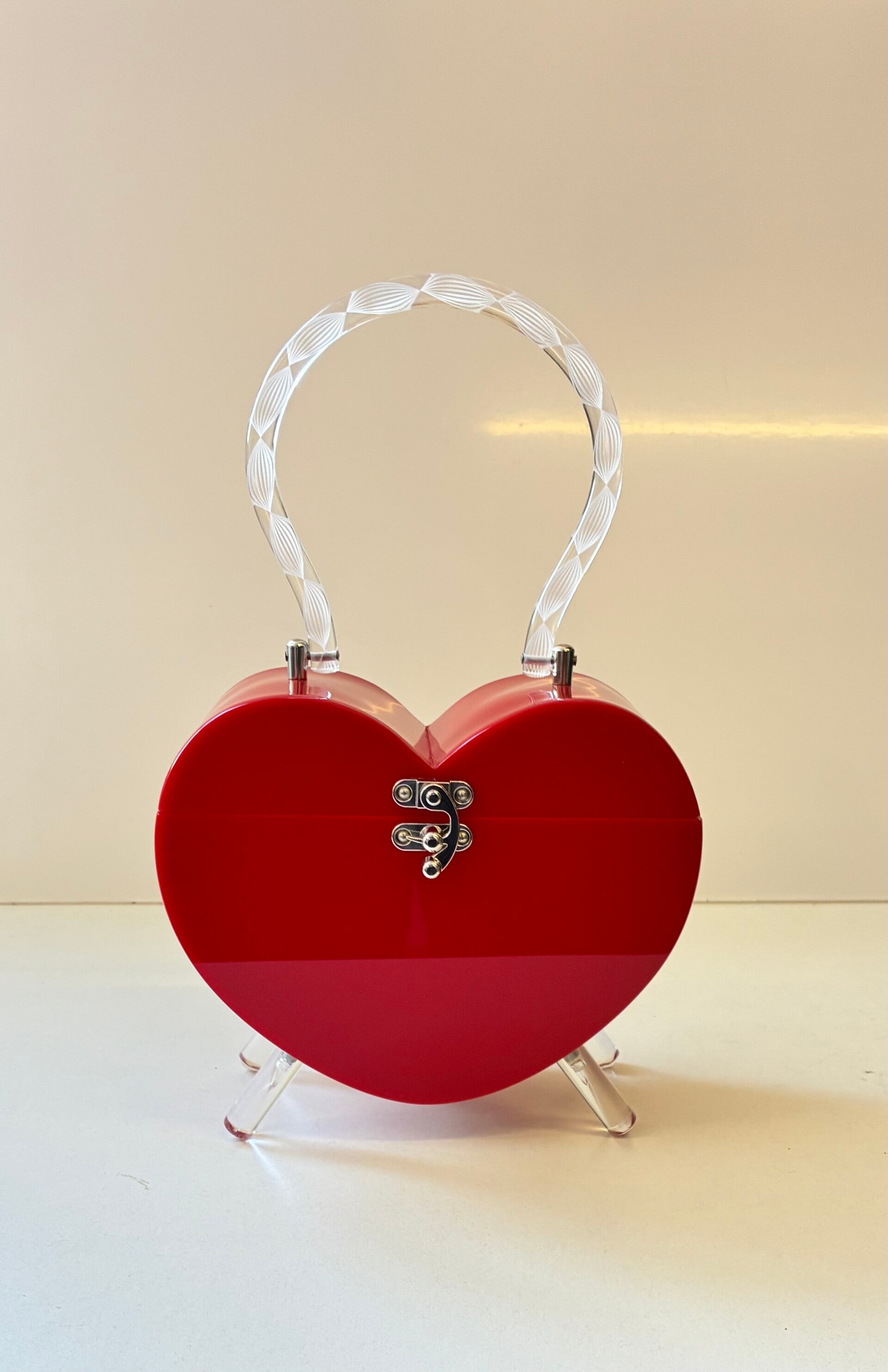 Heart Lucite style purse.