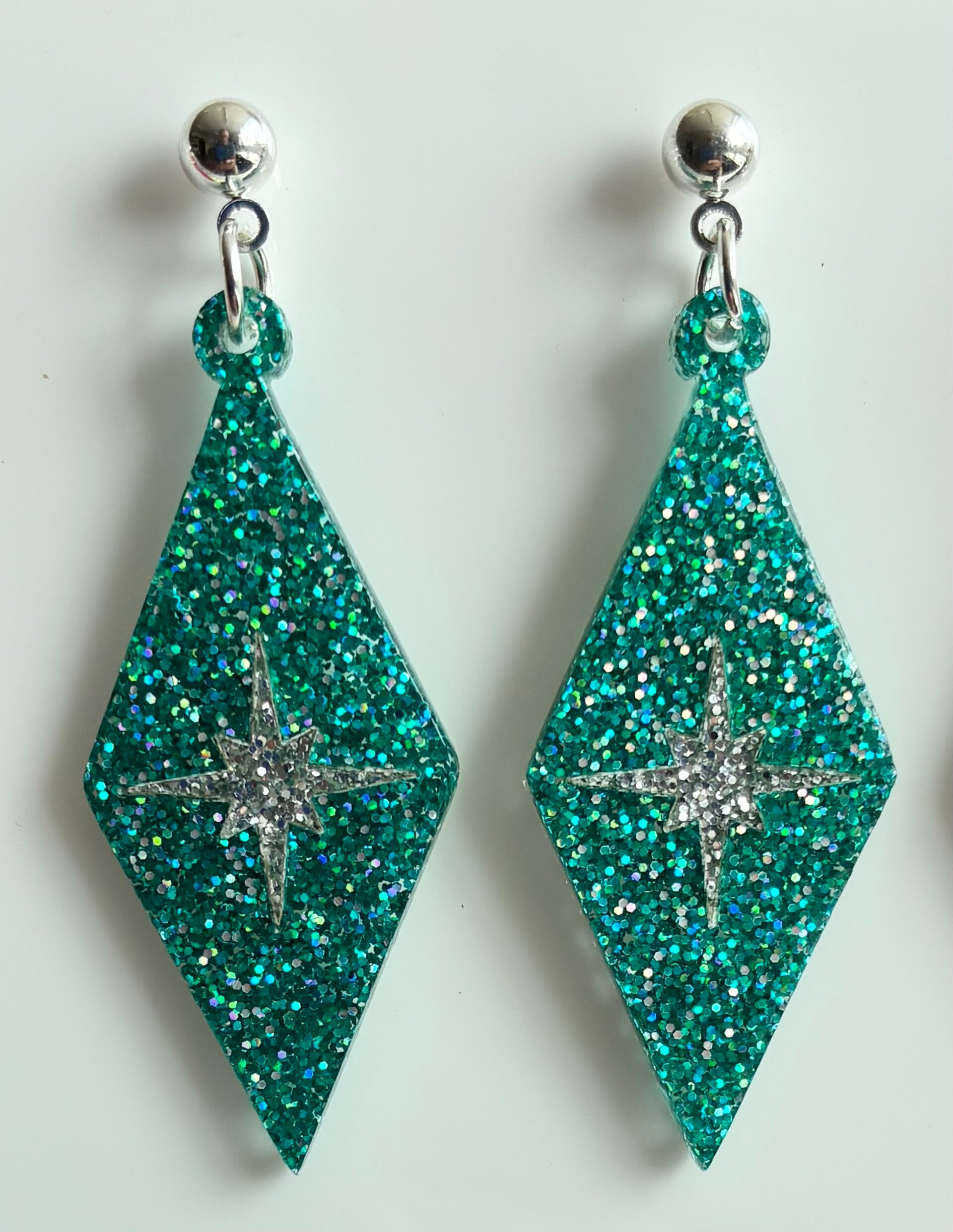 Harlequin Earrings in Various Glitter materials with Atomic starburst centres