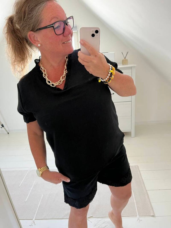 Blus svart