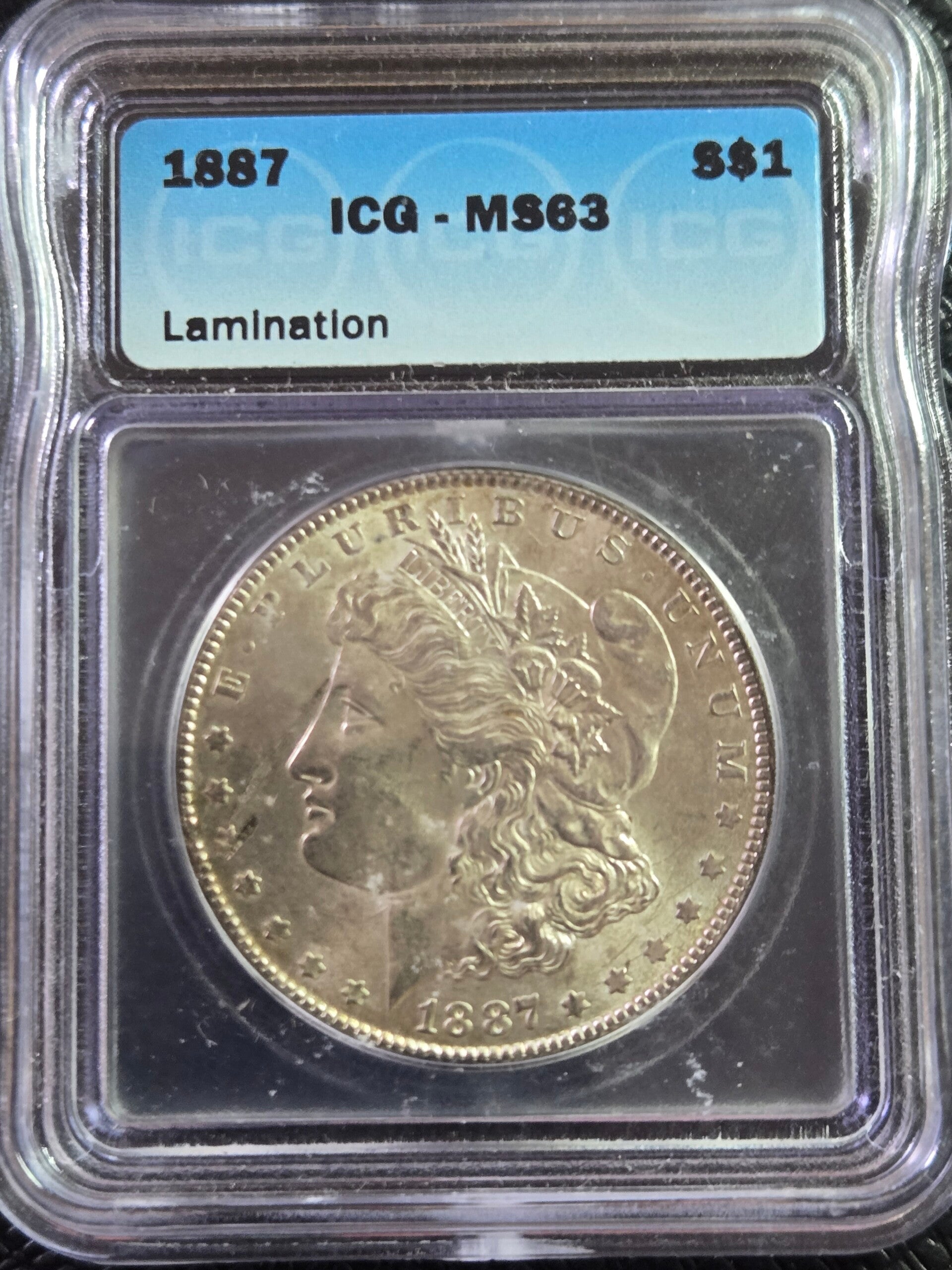 1887 ICG Graded MS63 Morgan Dollar Lamination