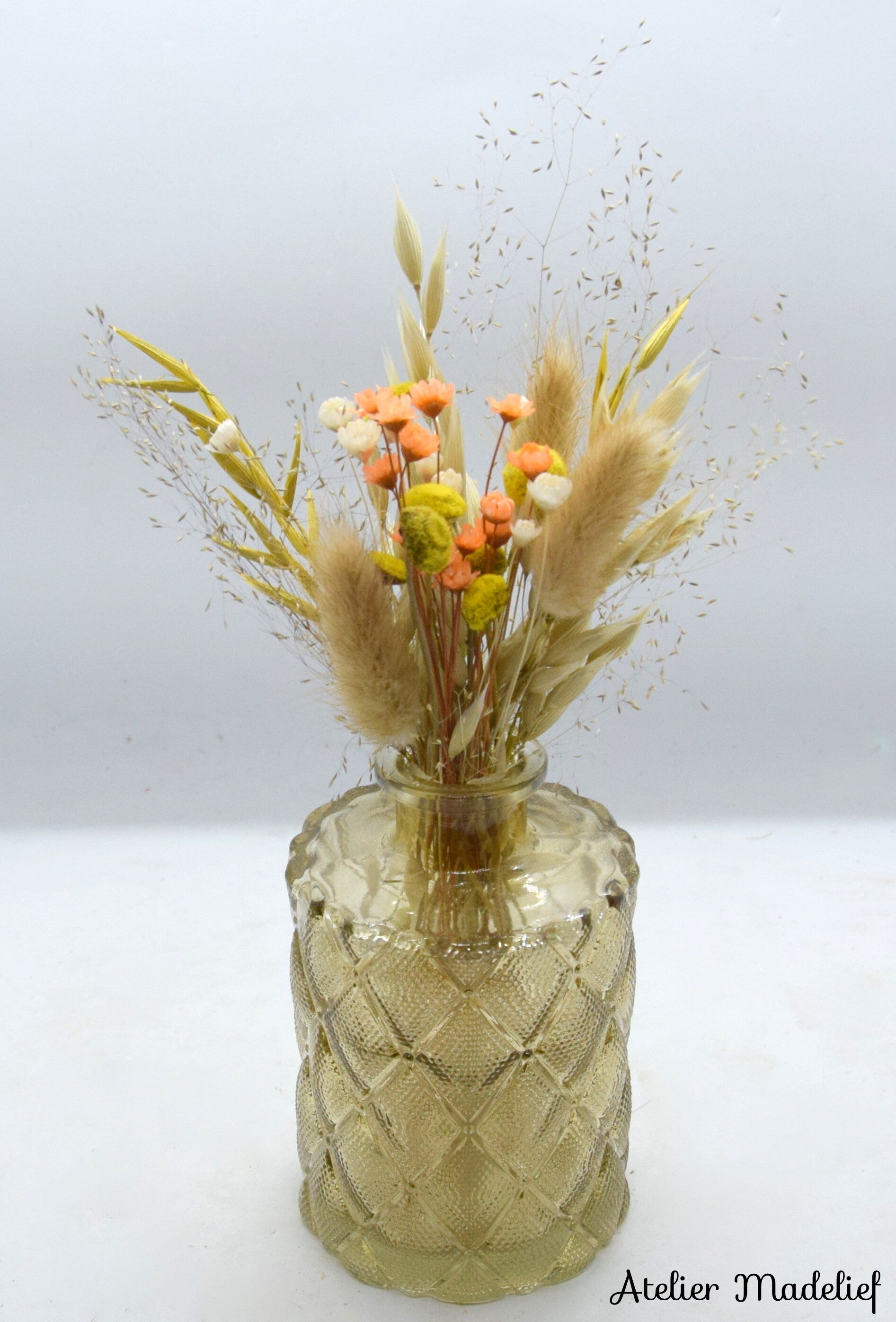 Gouden vaasje met bloemcreatie