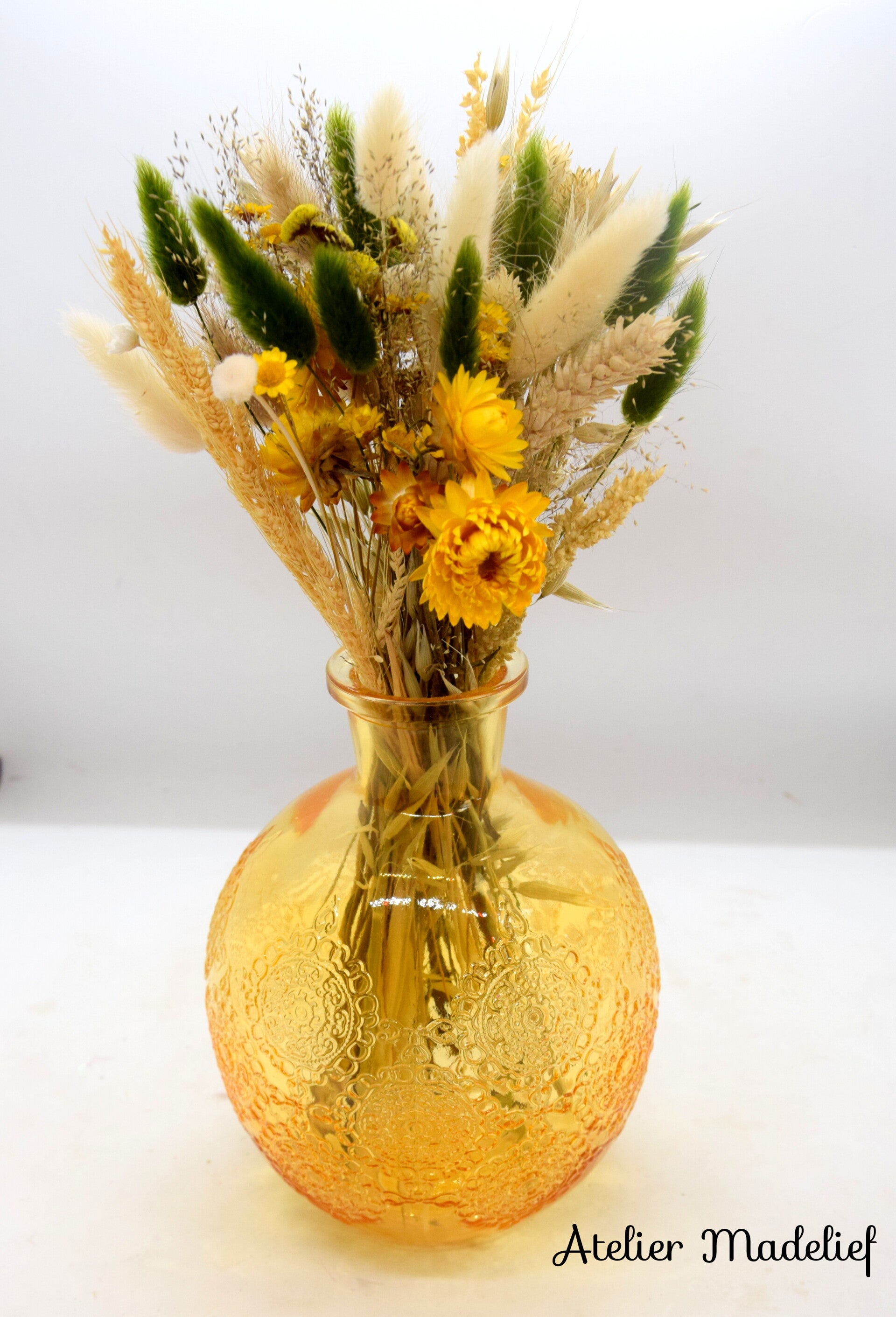 Gele vaas met geel/groen boeket