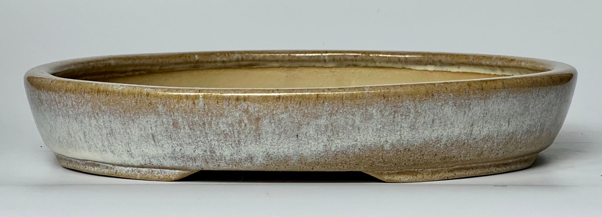 55. Ovale marron/blanc 29x24x4,5