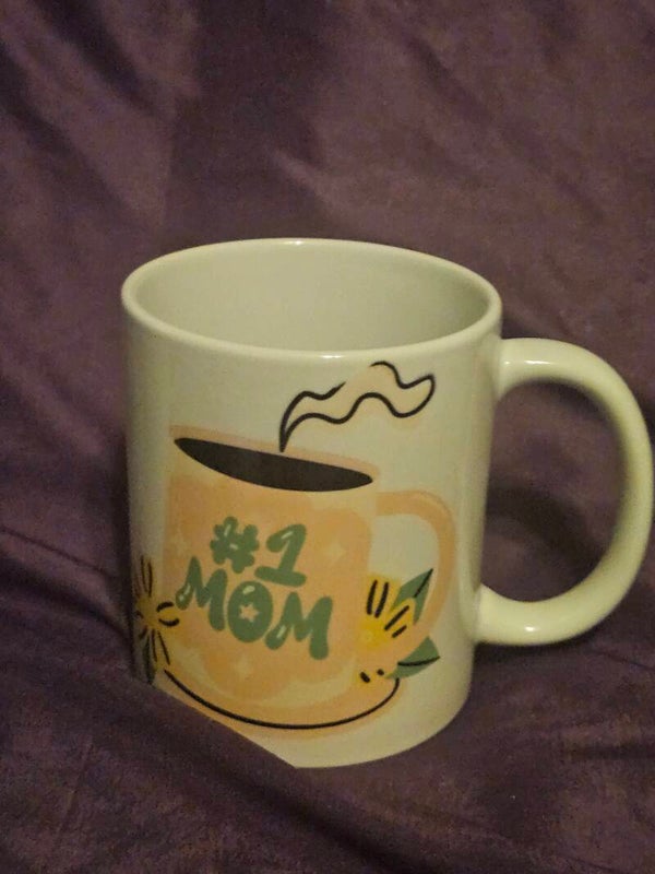 This is a charming #1 Mom ceramic mug, perfect for gifting to the best mother.