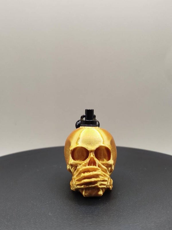 skull gold speak no evil