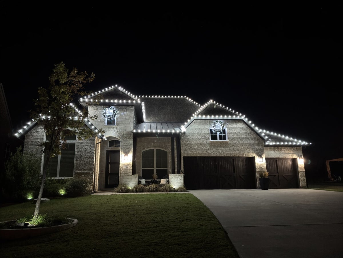 Clean roofline holiday lighting display in Fort Worth Texas by TrueLight Property Services