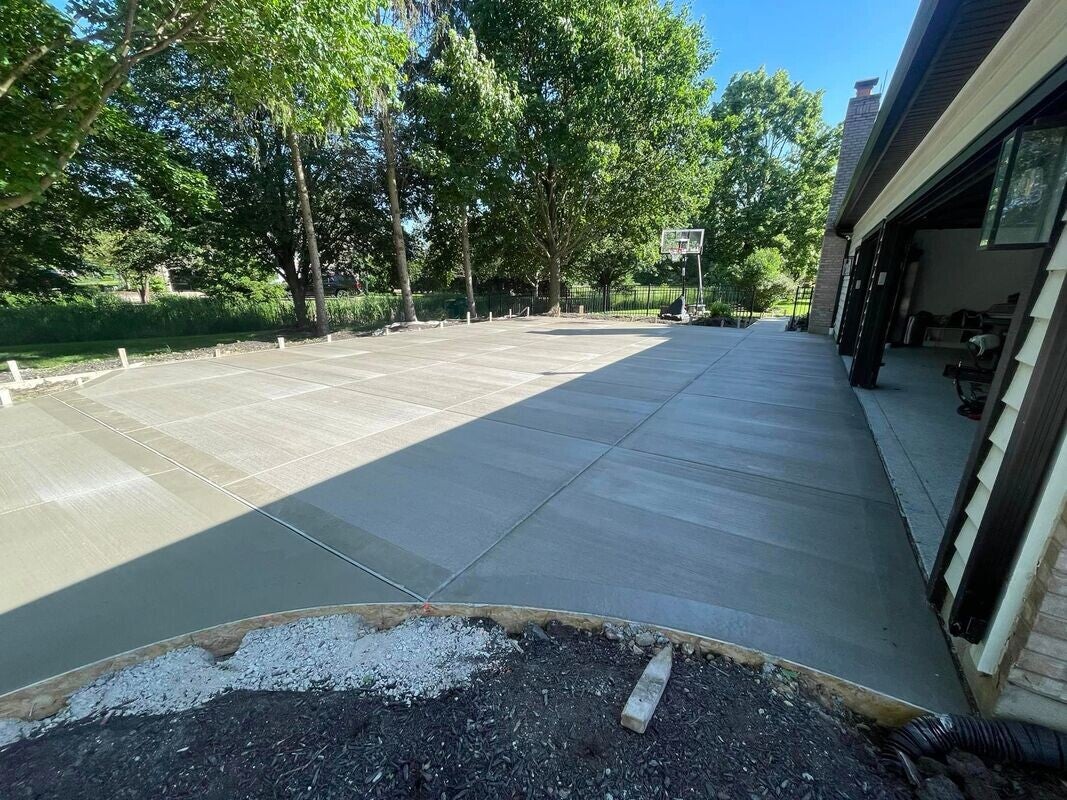 Custom concrete driveway and hardscaping work completed at a DFW residential property