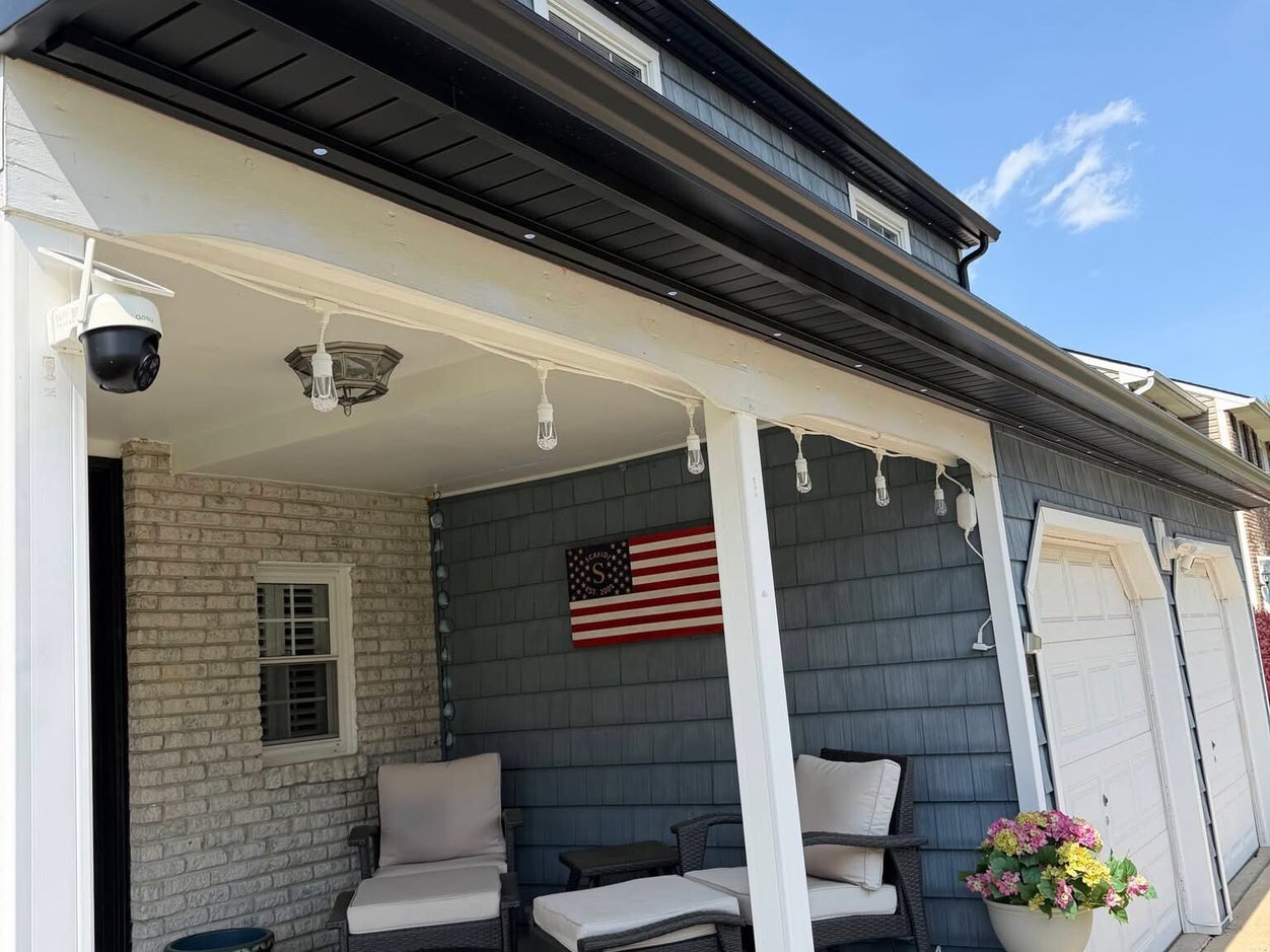 Daytime close-up of low-profile permanent lighting track installed under the roofline by TrueLight Property Services in Fort Worth Texas