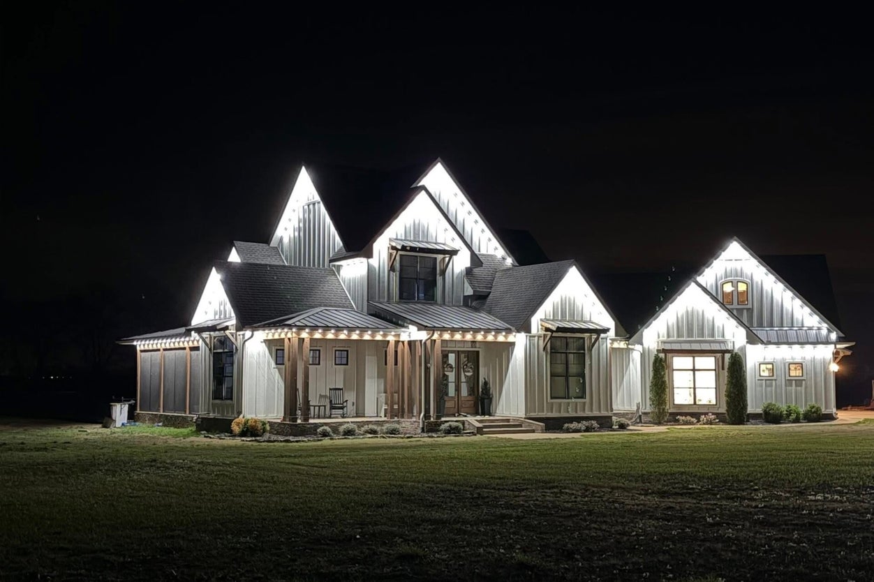 Nighttime full-home view with warm white permanent lighting installed by TrueLight Property Services in Fort Worth Texas
