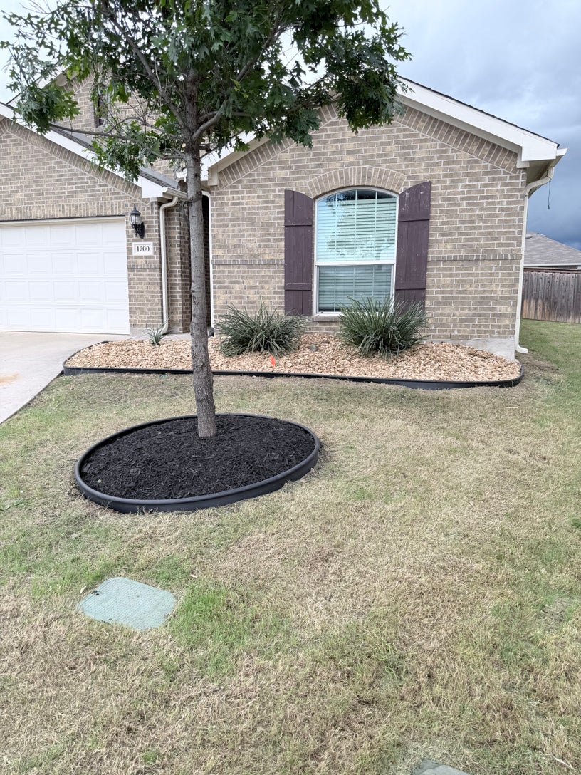 Defined landscape bed edging and clean exterior presentation for a DFW property