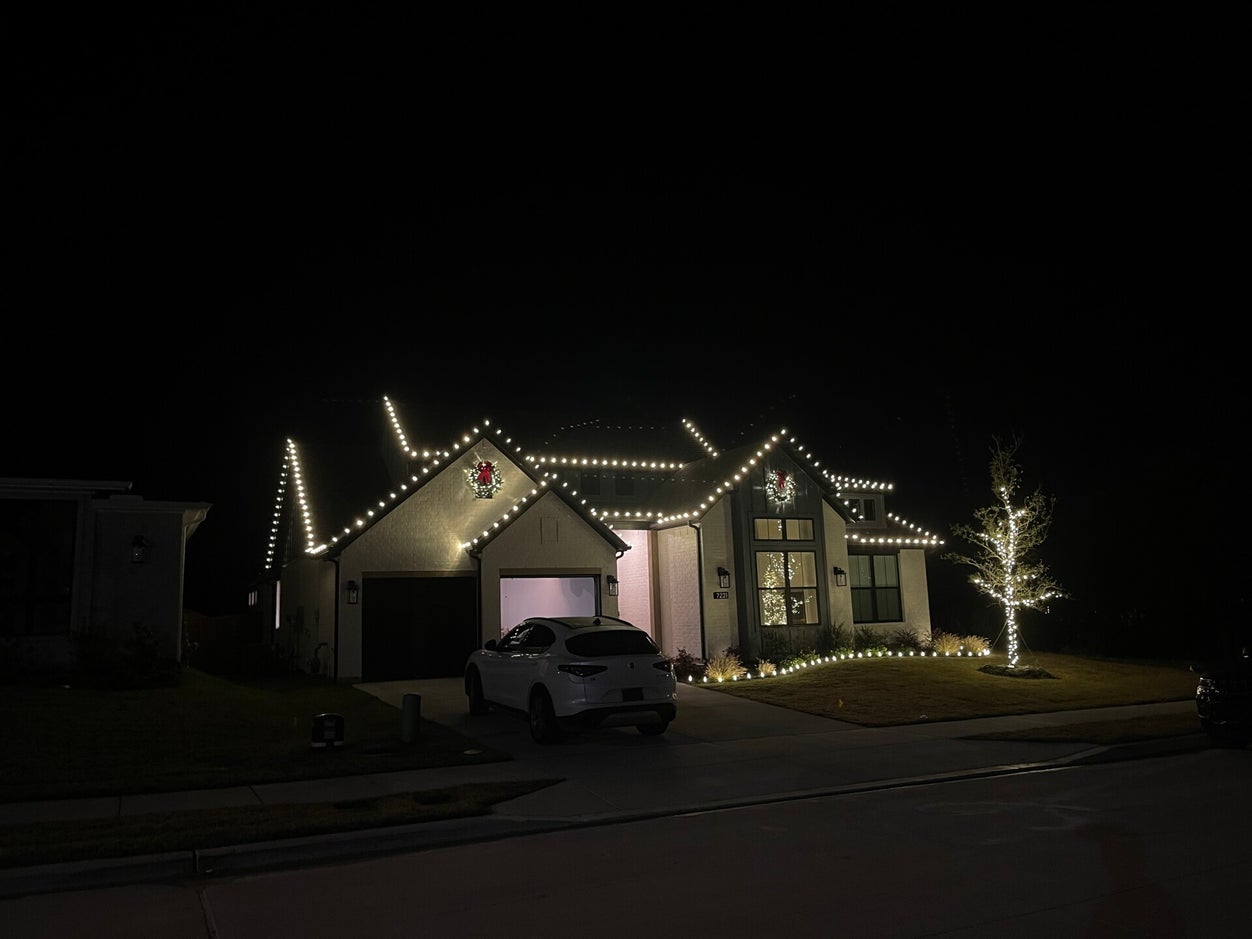 Trees wreaths garlands and flowerbed holiday lighting in Fort Worth Texas by TrueLight Property Services