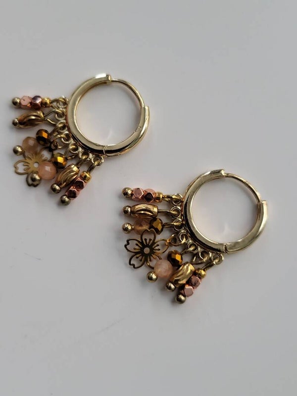 Goud rvs met bedeltjes