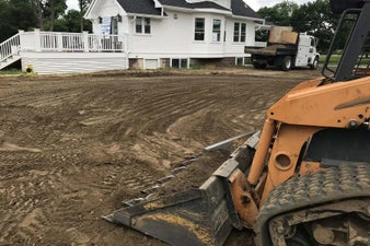 homeguide-contractor-leveling-a-backyard-for-drainage-issues-standard-t3l5m6.jpg