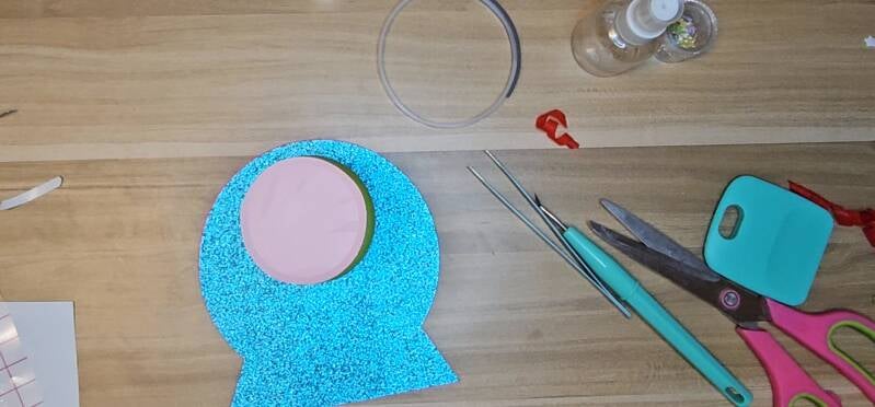 Place something flat and weighted over the easel. Wait for it to dry.