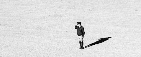 Minimalist photo of a soldier standing at attention, ideal for illustrating entry-level research into military ancestors