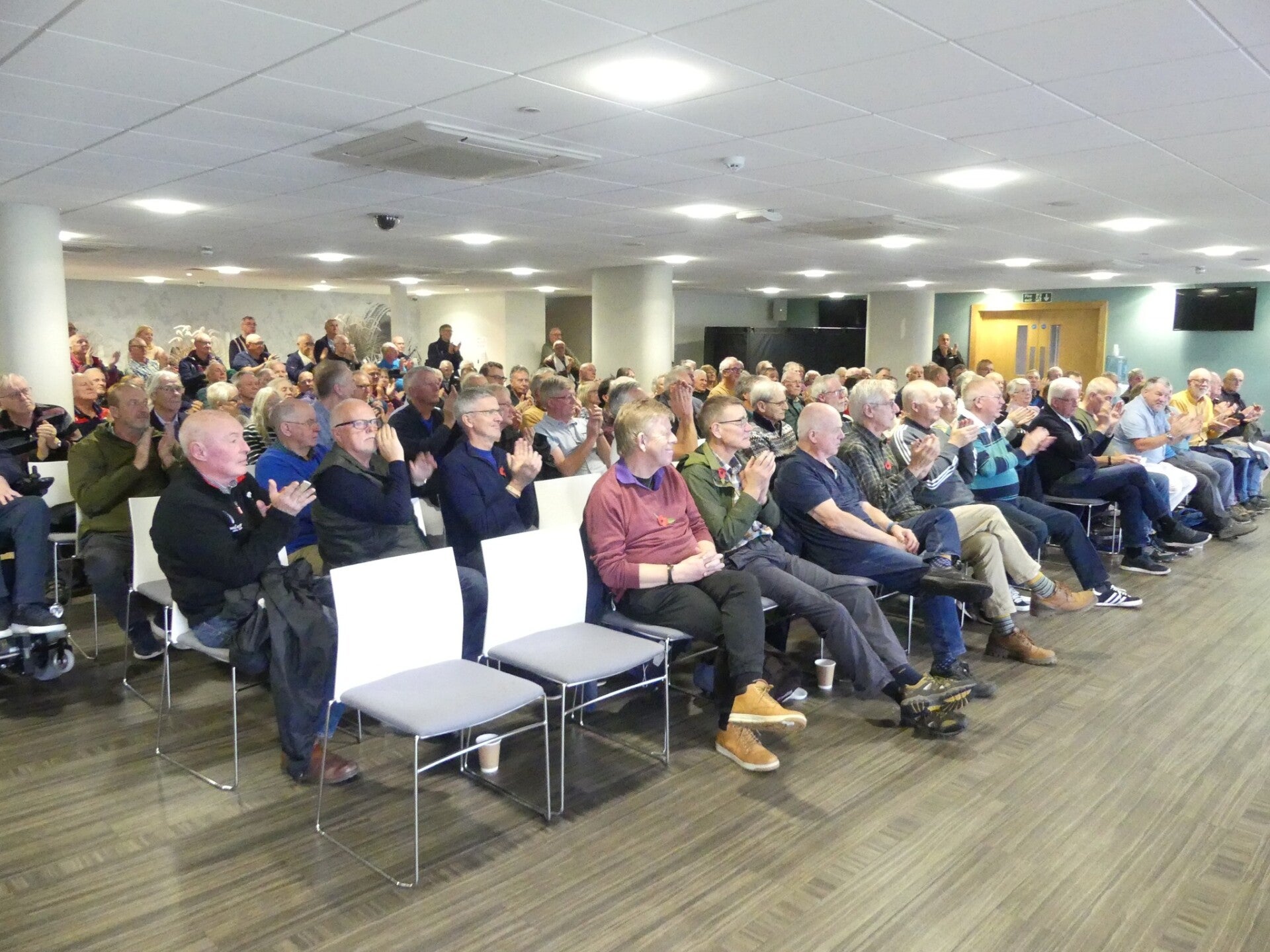 Audience listening to a military history talk at Gloucestershire County Cricket Club.