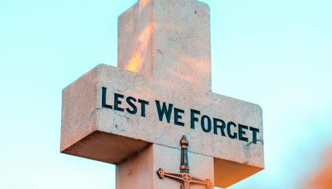 War memorial cross representing those named in British Army casualty lists from WWI and WWII
