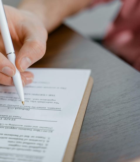 Person signing official paperwork, representing key British Army forms used in service record and pension research