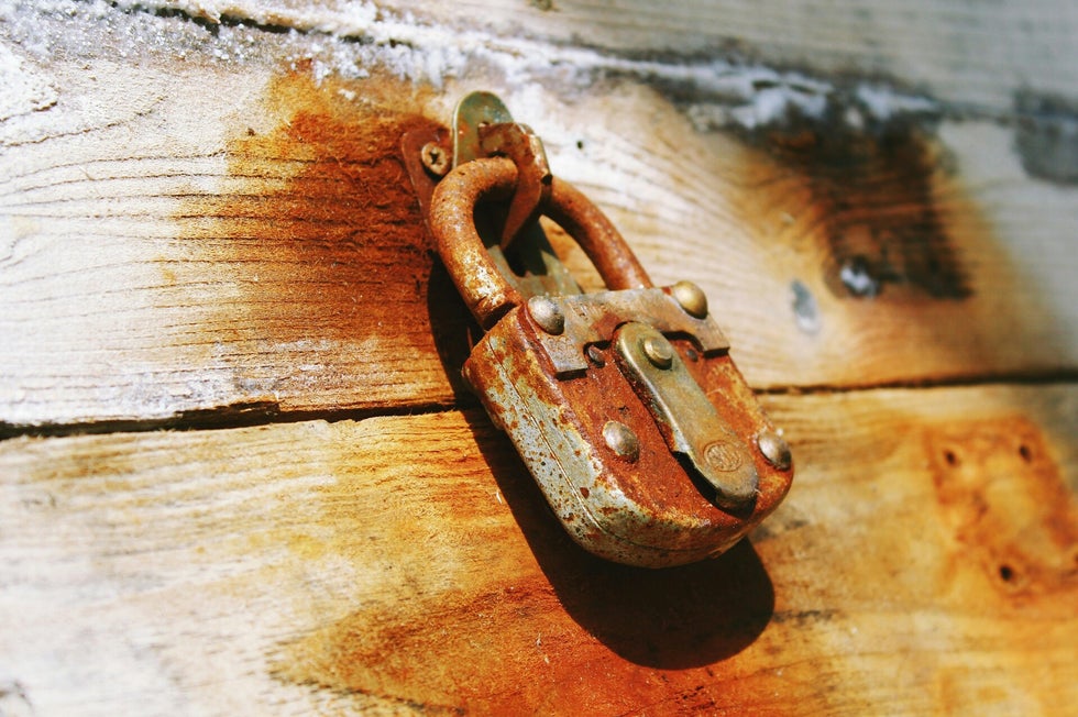 Rusty padlock symbolising the key role of service numbers in unlocking British military records