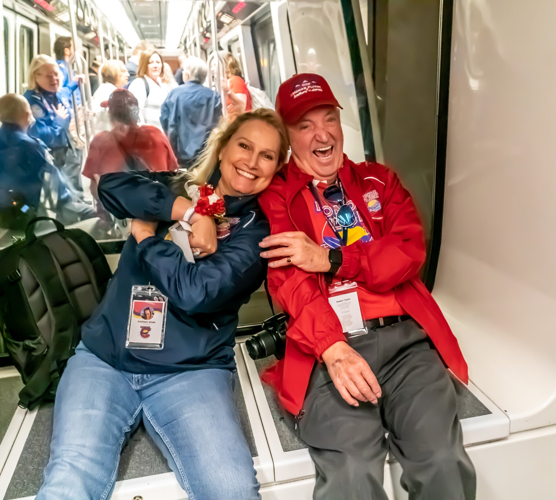 Guardian and veteran on train at Denver International Airport