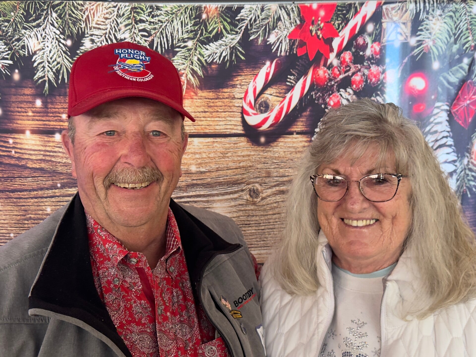 Two people smiling at holiday party