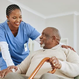 Dementia Male Senior and Caregiver smiling
