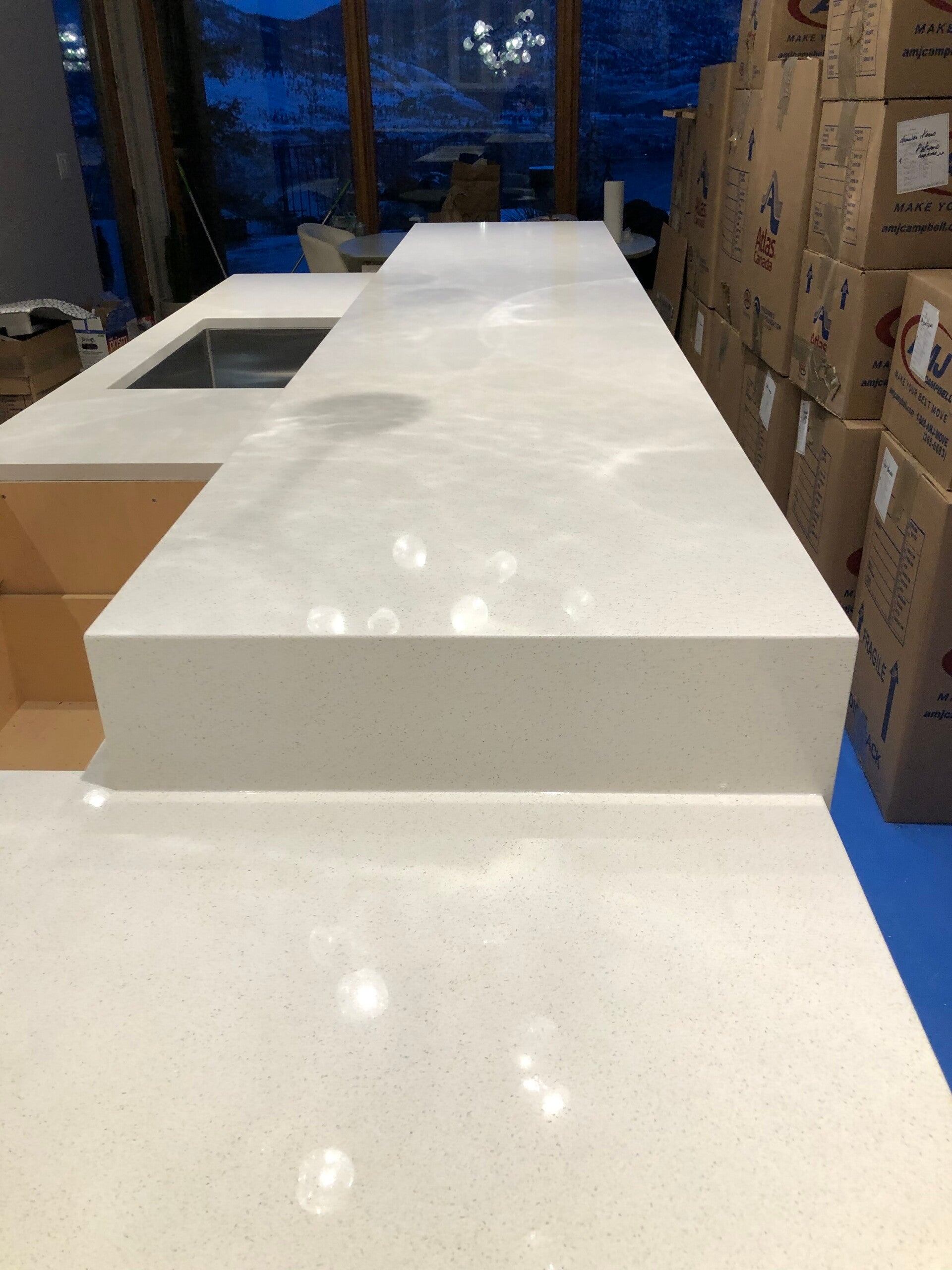 Thick white quartz countertop slab ready for precision fabrication