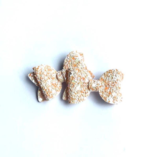 6 orange teeny weeny bows