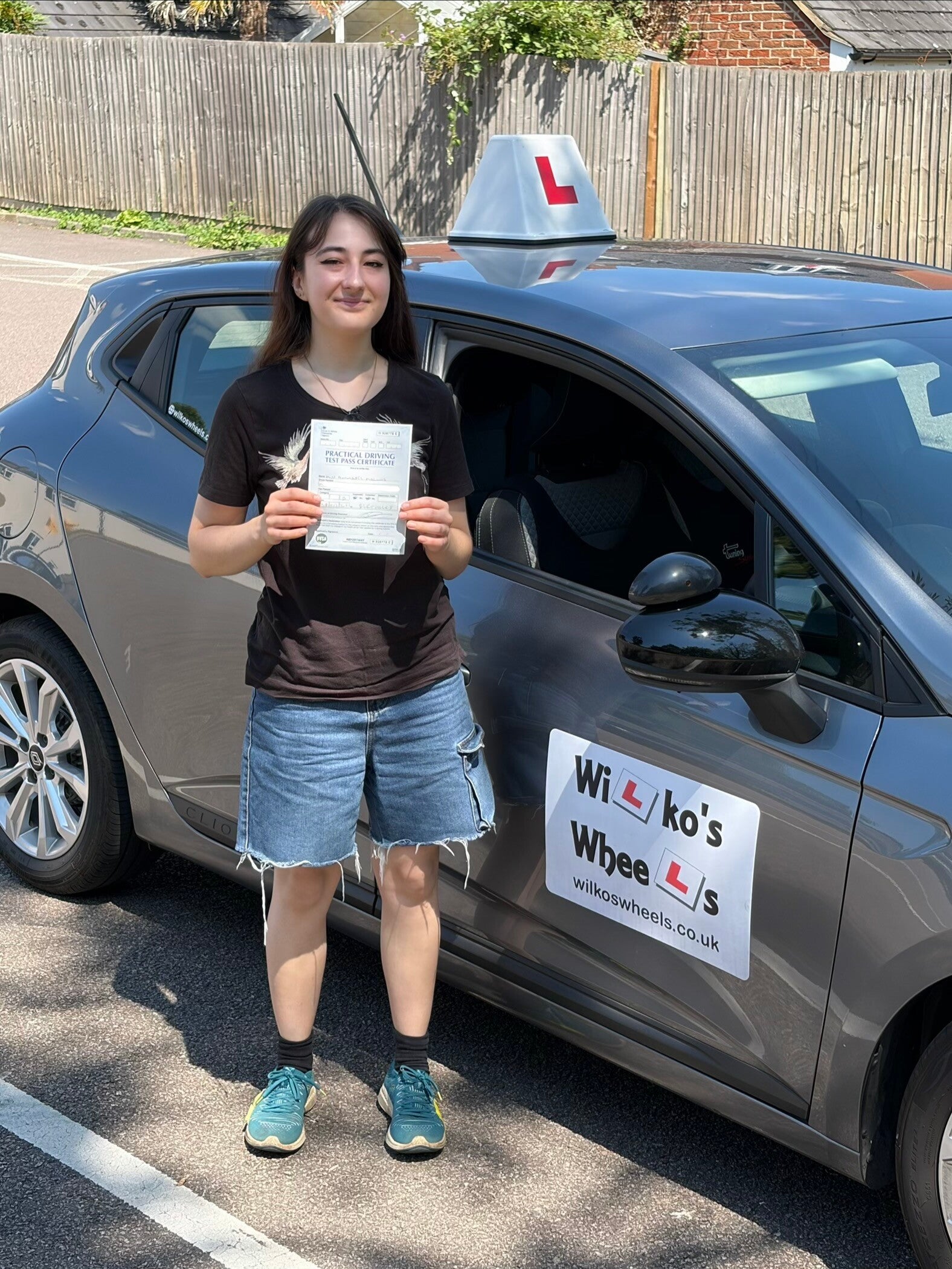 Happy driving test pass pupil with David from Wilko’s Wheels Driver Training, offering driving lessons in Milton Keynes, Newport Pagnell and Cranfield.