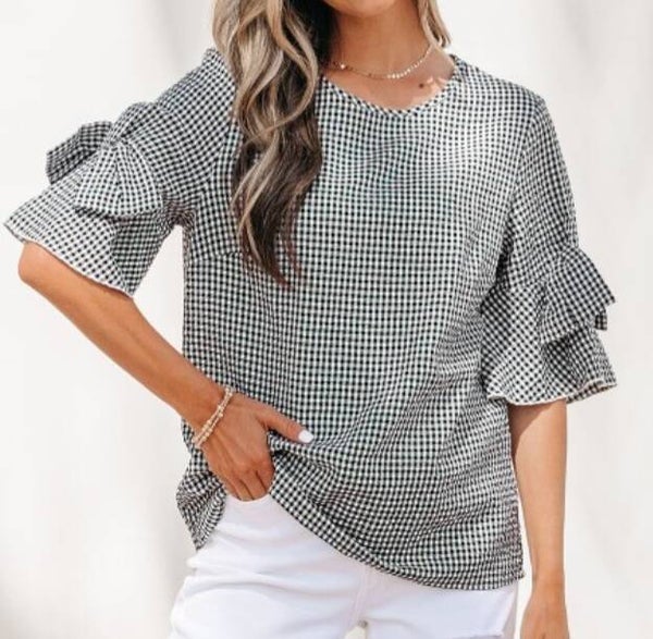 Black plaid top with bow detail on sleeve