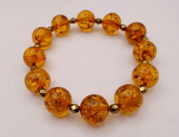 ARor014026: Prachtige barnsteen armband op elastiek.
