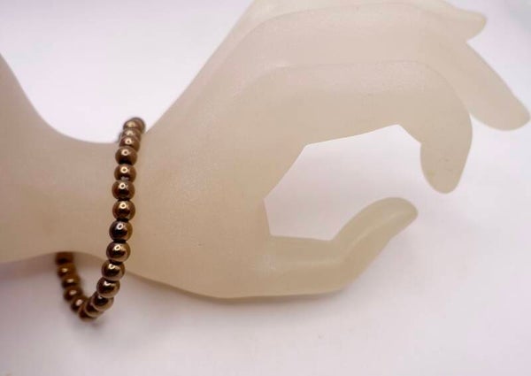 ARbr014625: Donkerbruine, hematiet armband!