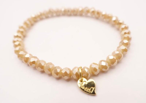 ARec084724: Ecru/creme armbandje met goudmetalen bedeltje.