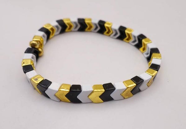 ARmix013326: Stoere, maar ook elegante armband in zwart, wit, goud.