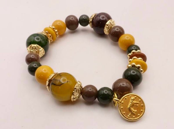 ARmix014226: Elastisch armbandje in warme tinten: oker, groen, bruin, etc.