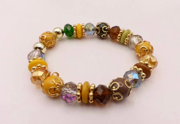 ARmix024226: Elastisch armbandje in warme tinten: oker, groen, bruin, etc.