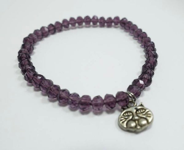 ARpa014623: Paars, transparant armbandje met kattenkopje-bedel.