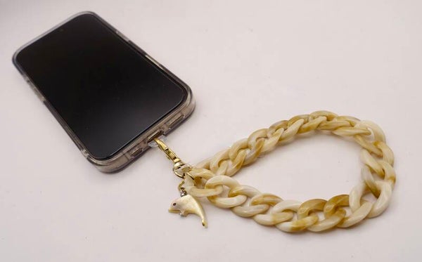 Telkgrij010526: Gevlamde, grijze telefoonpolsketting met hematiet sleutel.