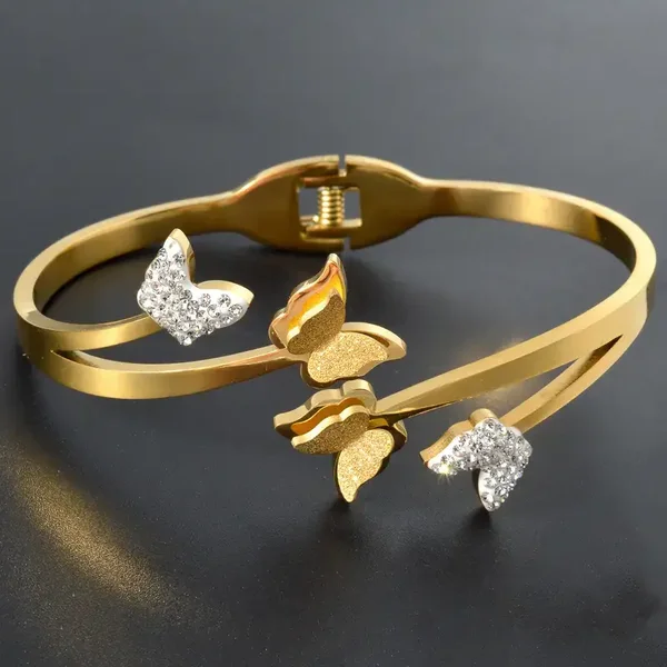 Bracelet papillons dorés avec strass et paillettes