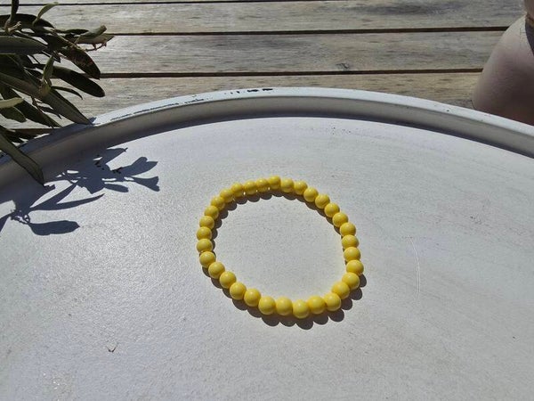 armband uit gele ronde kralen