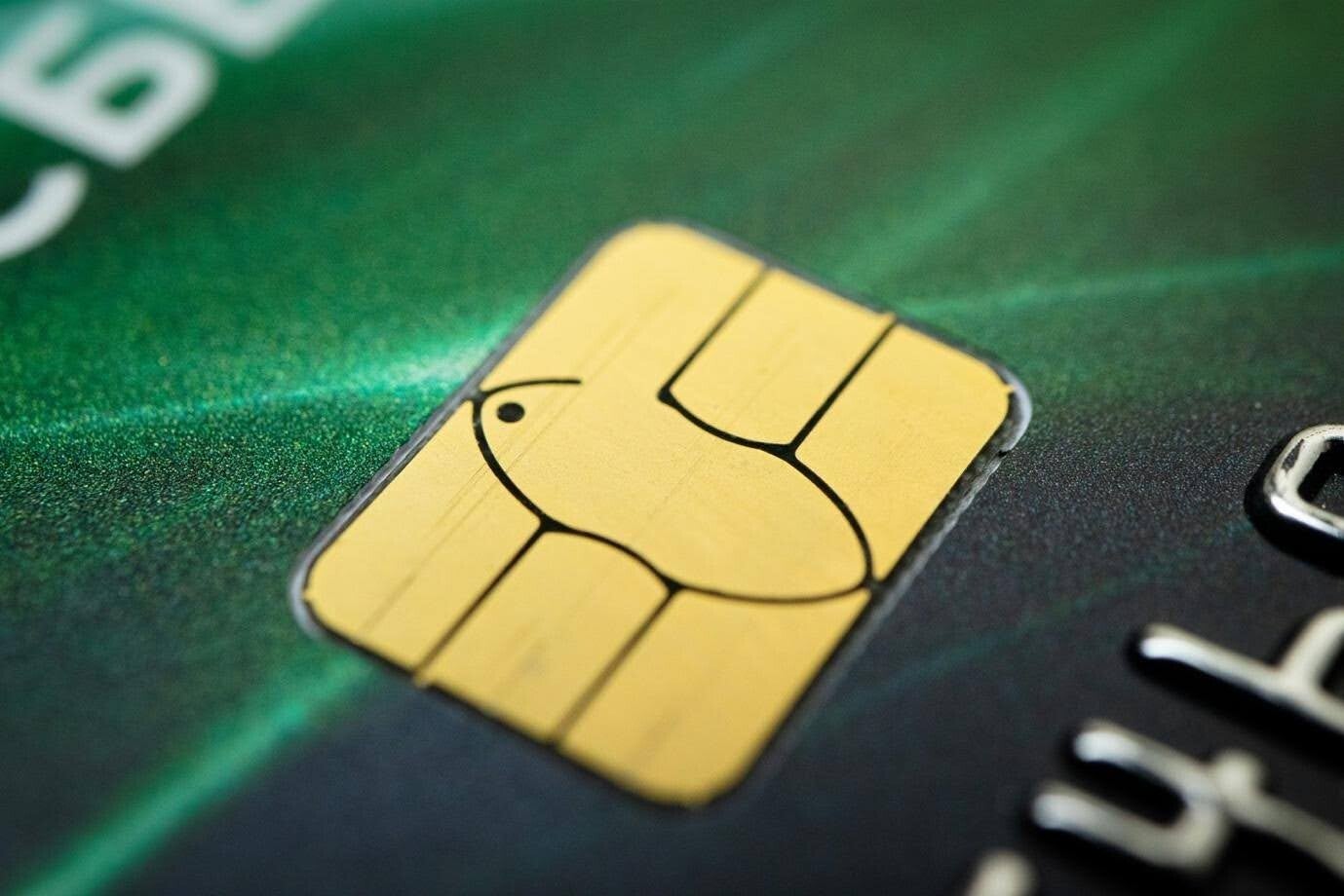 Close-up of a gold EMV chip on a payment card